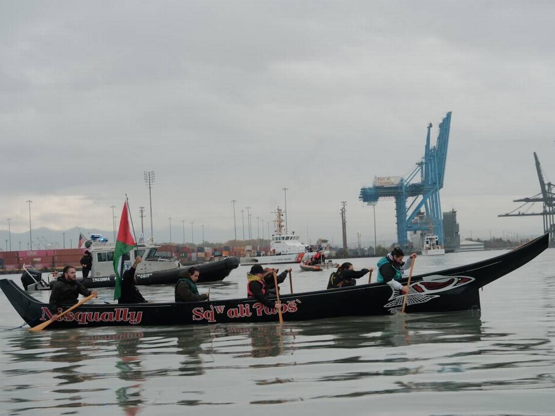 Coast Salish water warriors aboard a traditional Nisqually canoe paddle into the Port of Tacoma in an effort to block the MV Cape Orlando from leaving the port, on Monday, Nov. 6, 2023. (Photo/Logan Price)