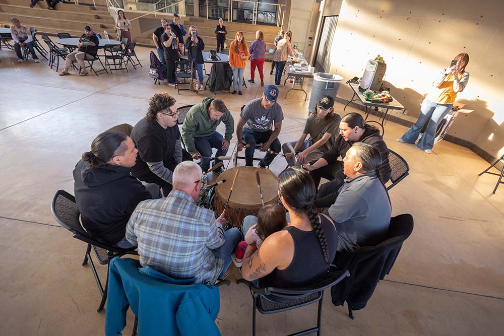 A drum circle with members of Prairie Rose Wellbriety, a group for Native Americans in recovery, for people trying to get sober, or friends and family supporting them. They have several recovery meetings (or talking circles), both men's and women's, and host a community night the fourth Wednesday of the month at the Mid-America All-Indian Center in Wichita. ALL PHOTO CREDITS TO: Jeff Tuttle