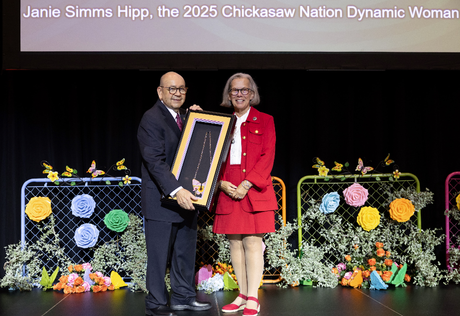 Chickasaw Nation Governor Bill Anoatubby presents Janie Simms Hipp, J.D., LL.M., as the 2025 Chickasaw Nation Dynamic Woman of the Year during the annual Dynamic Women of the Chickasaw Nation Conference conducted May 29-30 at WinStar Resort and Convention Center. Hipp, a Chickasaw citizen from Fayetteville, Arkansas, has dedicated her almost 40-year career to protecting food sovereignty through work in agriculture law. (Photo/Chickasaw Nation Media)