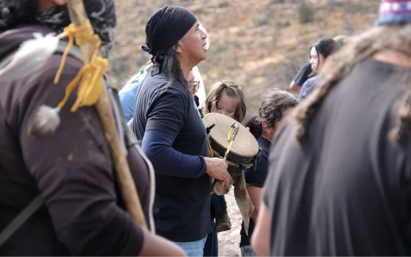 Members of Apache Stronghold, a nonprofit organization comprising Indigenous activists and religious leaders, gather to rally against copper mining at the Oak Flat site in Arizona. (photo/Steve Pavey for Truth Dig)