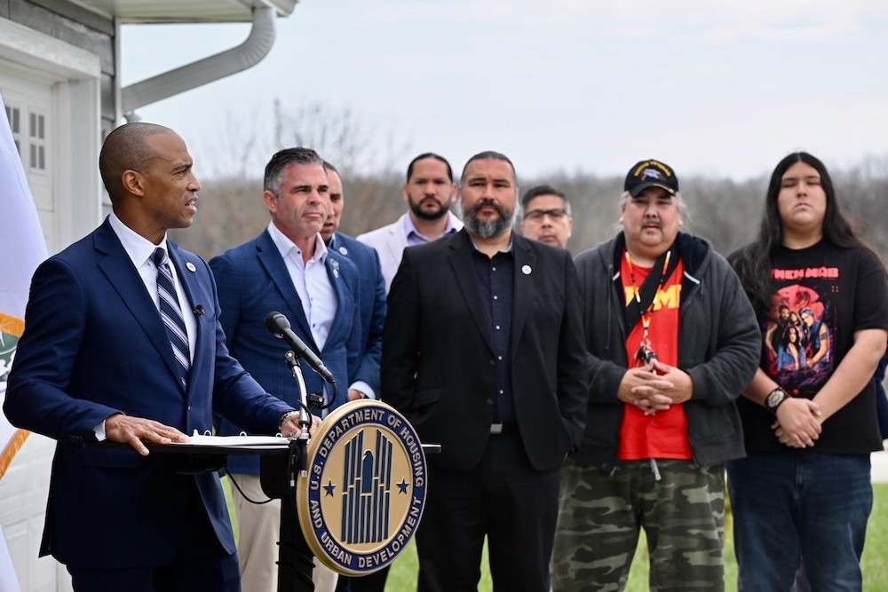 HUD Secretary Scott Turner (at podium) tours the Oneida Nation reservation in Green Bay, Wis., where he met with tribal leadership and announced $2.2 million in new funding for the Tribal HUD-Veterans Affairs Supportive Housing program. Turner has also emphasized expanding Section 184 loan opportunities to increase homeownership across Indian Country. (Photo: HUD)