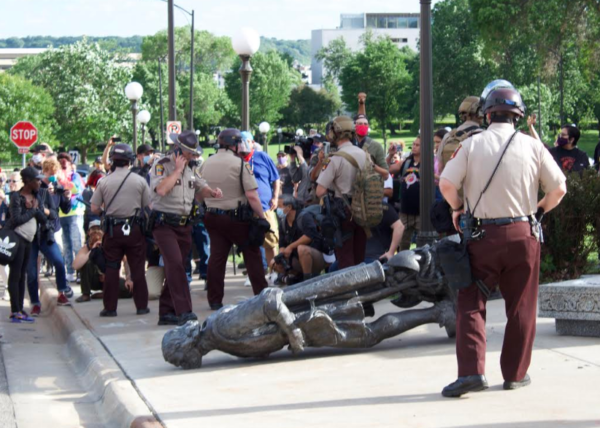 Christopher Columbus statue came down with a thud. Native News Online photographs by Darren Thompson Christopher Columbus statue came down with a thud. Native News Online photographs by Darren Thompson